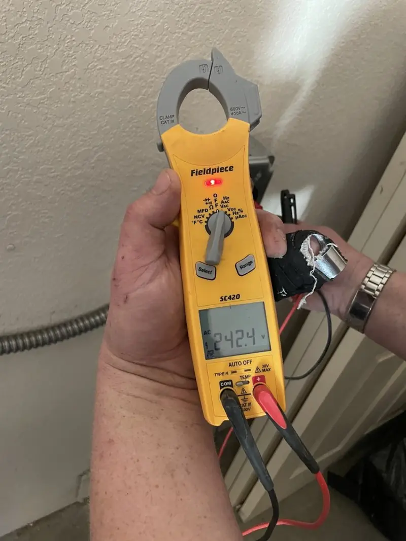 Voltage testing with clamp meter during Recessed Lighting Installation in Holts Summit